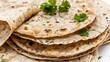 © we3_food - Chapati tortillas with fresh parsley are isolated in close up on a white background. Generative Ai