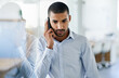© peopleimages.com - Man, thinking and listen phone call in office with news, client feedback and development in real estate. Property, realtor and chat to contact planning decision in business or idea for investment