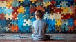 Young boy sitting and gazing at a vibrant jigsaw puzzle wall, deep in thought