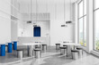 Minimalist cafe interior with dining zone and bar counter with panoramic window