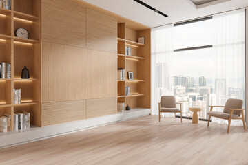 Wooden living room corner with armchairs and bookcase