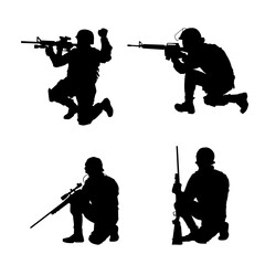 Wall Mural - Silhouette of a shooter in squat position. Silhouette of a male soldier in action pose with his machine gun.