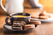 Freshly Brewed Coffee in Cup With Chocolate Cookies on Saucer