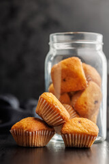 Poster - Magdalenas the typical spanish plain muffins on black table.