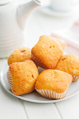 Poster - Magdalenas the typical spanish plain muffins on plate on white table.