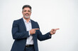 © Stock 4 You - Smiling mature 40s old grey haired businessman in formal suit, pointing both hands at copy space for promo advertising. Businessman standing and point isolated on white background, looking camera