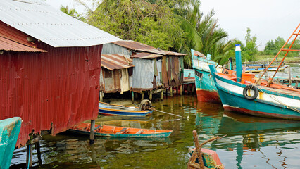 Wall Mural - colorful fisher boats in a harbor in kampot