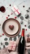 Valentine's day dinner concept. Top view table with setting for romantic dinner, bottle of wine champagne, glasses, white gift box, candies.