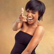 You, pointing or portrait of happy black woman with hair care for keratin growth, healthy shine or wellness. Laughing, studio or face of girl with natural texture, joke or glow on brown background