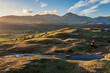 Stunning, Spring sunset landscape aerial drone image in Lake District looking towards Old Man of Coniston