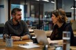 © yj - two business people having a discussion about business with laptops on the table, sitting together in an office, positive vibe. generative AI