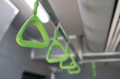 The green handles on the train are bright and eye-catching
