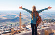 Happy tourist woman enjoying old Mardin city panoramic view. Turkey
