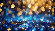 Shiny sapphire glittery bokeh with blue and gold colors sparkling festive light spotted backdrop.