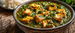 Palak Paneer is a popular North Indian dish made with paneer Indian cottage cheese cooked in a creamy spinach sauce flavored with onions, garlic, ginger, and spice