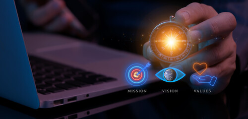 Purpose business concept. Corporate communications to specify policy and business direction. Businessman holding compass to show glowing neon line of mission, vision, values icons.