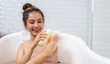Portrait of smiling happy beauty asian woman enjoy relax clean healthy skin spa treatment scrub taking shower and bath with soap spa,shampoo bodycare product at bathroom.Self-love and Self-care
