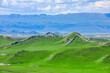 Green grassland and mountain natural landscape in Xinjiang, China. Summer landscape.