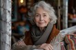 © Aaron Weiss - Portrait of a stylish elderly woman looking at the camera and smiling. Street on blurred background