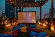 Night photo. Outdoor Movie Night Concept. Cozy setup for open air movie under the stars with a large movie screen and colorful bean bags on a roof top of a high-rise. Outdoor Theat
