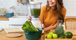 Portrait of beauty healthy asian woman making green vegetables detox cleanse and green fruit smoothie with blender.young girl drinking glass of smoothie, fiber, chlorophyll in kitchen.Diet, healthy