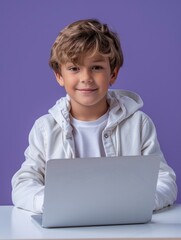 Wall Mural - Portrait of a smiling young boy using laptop