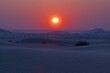 Sunset over sand dunes in the Empty Quarter desert of Saudi Arabia
