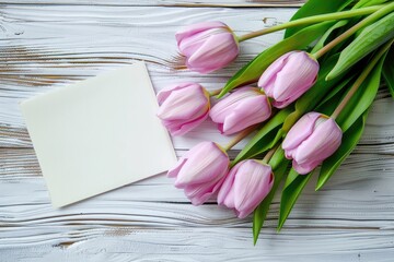 Poster - Beautiful Mothers Day Pink Tulips on a a Rustic Wooden Table with Card for Copy