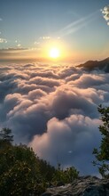 Amazing Sunset View From The Top Of The Mountain Above The Clouds