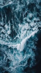 Wall Mural - Aerial views over crashing sea waves on rocking ocean crop