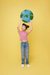 asian child girl holding earth Sustainable world environment, CSR with people, ESG campaign, international children's day concept