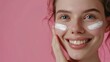 © pinkrabbit - Beautiful woman smile use cream for good skin. face of a healthy woman apply cream and makeup. Advertisement for skin cream, anti-wrinkle, baby face, whitening, moisturizer, tighten pores