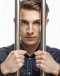 portrait d'un jeune homme enfermé en prison tenant les barreaux de sa cellule en ia