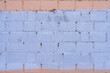The old wall is unevenly painted. Abstract construction background.