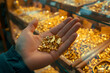 Hand holding gold nugget, the background is gold shop, discovery of gold and the increasing demand or supply for gold, the increase in the price of gold