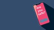 A smartphone on a minimalistic pink background displays 'Are you safe', highlighting the importance of safety communication