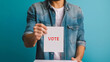 © Loucine - Man putting ballot into voting box on blue background, Elections voting, hand dropping vote