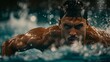 © sorin - Aerial view of male swimmer training butterfly technique in pool for championship
