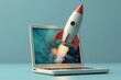 © tanapat - A rocket launching from a laptop screen. The rocket is red and white, and the laptop is silver. The background is blue.