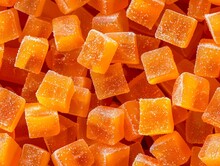 Orange Gummy Candy Background. A Close Up Of Orange Sugar Cubes.