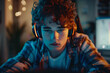 © Vera - Focused Gamer: Young Man with Headphones Playing Video Games on Computer