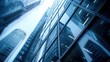 © Matthew - An upward perspective of sleek modern glass office buildings, reflecting the concept of corporate business and architecture