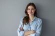 © Ashalina - Photo of a smiling businesswoman standing with arms crossed. Generate AI image