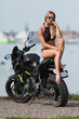 young woman with a sports motorcycle