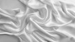White silk fabric with soft waves and folds, elegant and smooth satin textile background