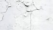 White cracked concrete wall texture background with peeling paint
