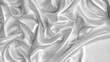 White silk fabric with soft waves, elegant and shiny satin textile background