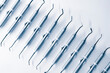 set of steel dental instruments on white background