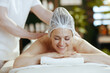 massage therapist in spa salon do therapeutic massage