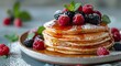 Delicious Stack of Pancakes With Berries and Syrup